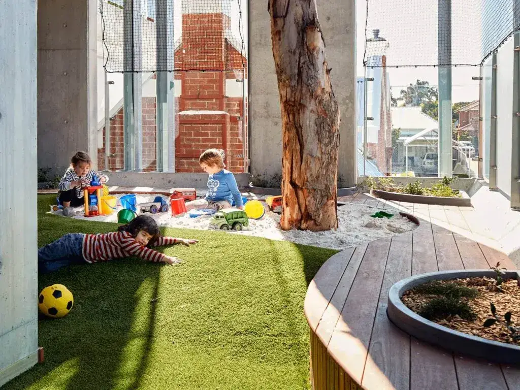 Children playing in a childcare centre outdoor play area